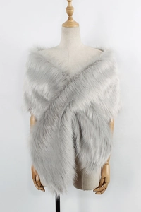 Detail shot of light grey faux fur shawl with plush texture and cross-wrap design