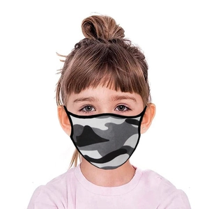 Detailed view of child wearing camouflage earloop face mask for sun protection and dust safety