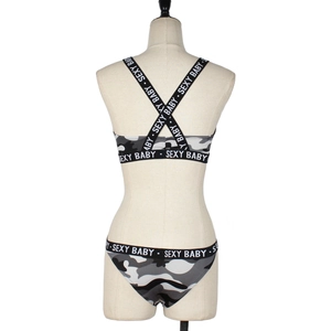 Detailed back view of camouflage lingerie set featuring criss-cross straps and elastic bands
