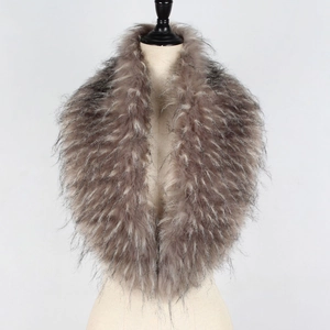 Detailed view of thick taupe faux fur collar scarf with dark tips on a beige mannequin