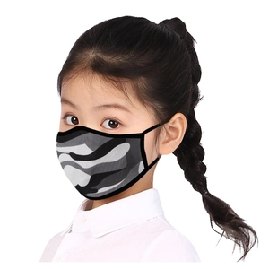 Close-up of a breathable camouflage face mask for kids with elastic ear loops