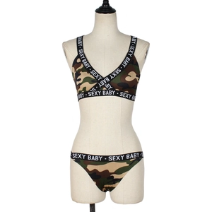 Detail of camouflage lingerie set with cross straps and sexy baby lettering on elastic bands