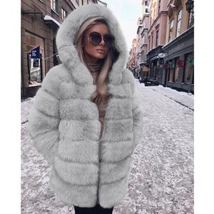 Close-up of light gray hooded faux fur coat with horizontal quilted texture in winter