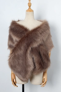 Macro shot of faux fur texture on a taupe cross-over bridal shawl for winter wear