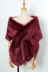 Macro detail of wine red faux fur stole showing fluffy texture and soft silky luster