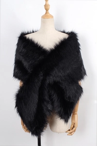 Detail of elegant black faux fur shawl showing plush texture on a mannequin bust