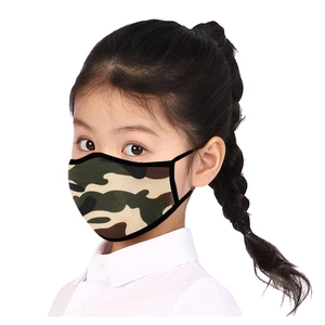 Detailed view of child wearing a breathable camouflage face mask with elastic ear loops