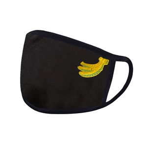 Close-up of black breathable fabric face mask featuring a small yellow banana embroidery