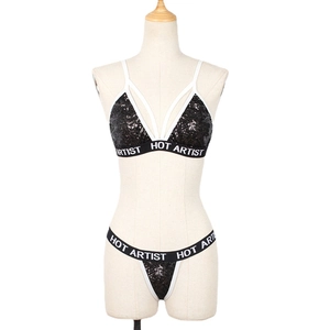 Two-piece black sequin lingerie set with HOT ARTIST lettering on elastic bands