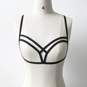 Detail of black elastic body harness featuring a multi-layer geometric strap design