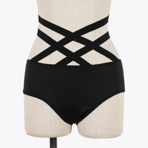 Detail of black high-waisted panties featuring sexy cross-strap cutout design at the waist