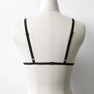 Detail of minimalist black strappy back bra with adjustable sliders and hook closure