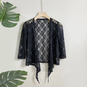 Women's black short lace cardigan with floral hollow design and tie-front closure