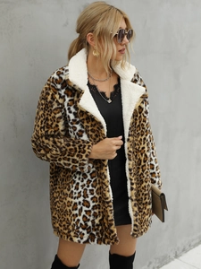Close-up of leopard print faux fur coat featuring a soft white sherpa fleece collar