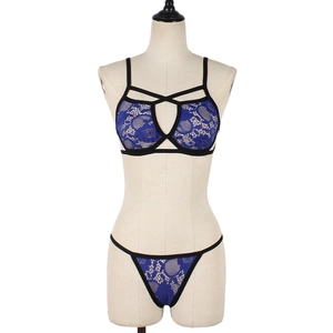 Detailed view of dark blue lace lingerie set featuring intricate floral hollow patterns