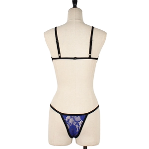 Detailed back view of royal blue floral lace lingerie set with black trim on a mannequin