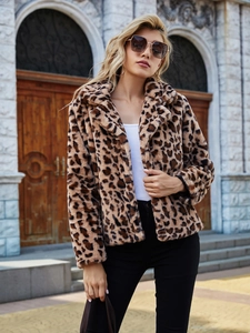 Close-up of faux fur leopard print jacket with textured fibers and lapel collar details