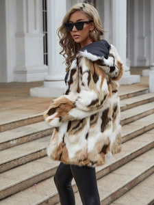 Detail view of the animal print faux fur hooded coat with soft beige and brown texture