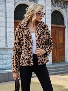Detailed texture of leopard print faux fur coat with stylish lapel on a model