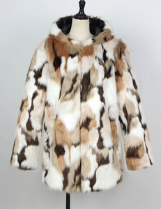 Detail of multi-color patchwork faux fur coat with plush hood and warm inner lining