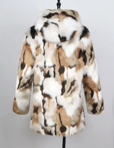 Detail view of the patchwork faux fur hood and textured multi-color back of the coat