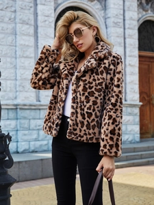 Macro detail of plush leopard print faux fur texture on a notch lapel jacket