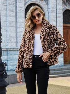 Detail of faux fur texture and leopard print pattern on a stylish winter jacket