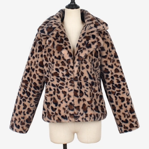 Close-up of fluffy faux fur texture and leopard print pattern on a winter jacket