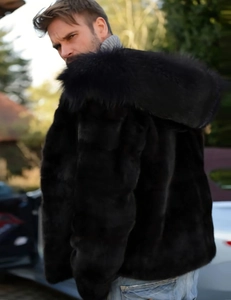Detail shot of men's black faux fox fur hooded coat with thick plush texture and glossy finish