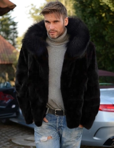 Detail of men's faux fox fur coat with a large black hood collar in an outdoor urban setting