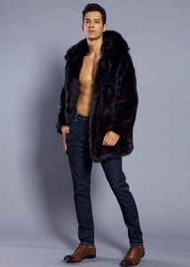 Detail of premium black faux fur texture on men's winter coat with thick hooded design