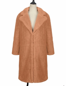 Close-up detail of the plush brown teddy coat texture and notched lapel design