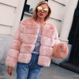 Detail of pink faux fur jacket featuring a horizontal stitched design and soft fluffy texture