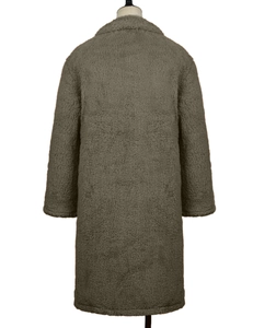 Detail view of the plush teddy faux fur texture on a long winter coat for women