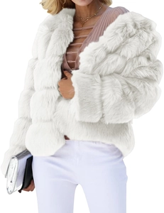 Detail shot of plush white faux fur jacket featuring thick layered texture and turn-down collar