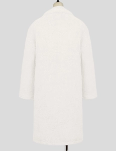 Back view of a white plush faux fur coat with a large lapel and soft lamb wool texture