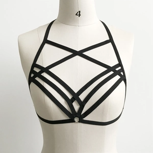 Detail of black elastic body harness featuring a pentagram geometric design and metal ring