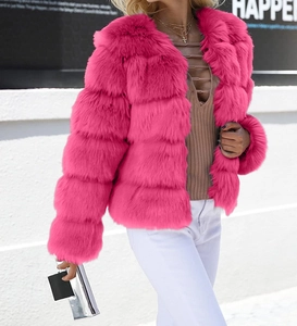 Detail of hot pink faux fur jacket featuring a layered horizontal stripe texture and collarless cut