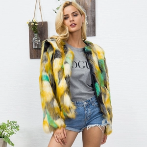 Close-up of colorful faux fur jacket with vibrant geometric pattern and fluffy texture