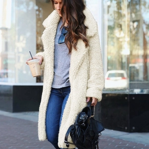 Chic beige faux fur teddy coat with wide lapels and long sleeves for winter street style