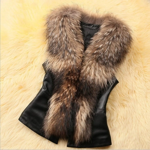 Close-up of fluffy faux raccoon fur trim on a slim fit black leather vest jacket