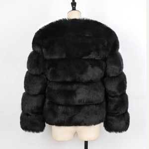 Back view of black faux fur jacket featuring horizontal tiered paneling and rich texture