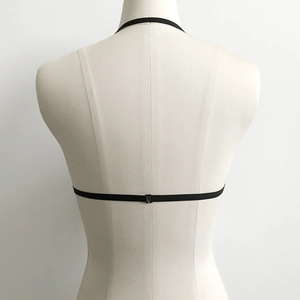 Minimalist black elastic harness lingerie top with metal back clasp on a mannequin
