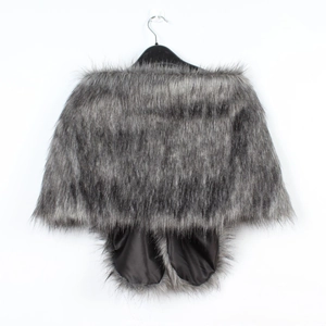 Detailed view of dark grey faux fur shawl with smooth black satin lining for evening wear