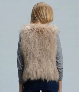 Back view of light khaki faux fox fur vest for women styled with a gray sweater