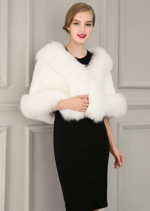 Close-up of a white faux fur shawl with plush texture for wedding and evening dresses