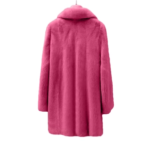 Detailed view of vibrant rose pink faux fur coat featuring a wide lapel and soft plush texture