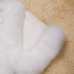 Elegant white faux fur bridal shawl wrap for winter weddings with soft fluffy texture