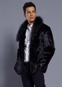 Detail of the thick faux fur shawl collar and smooth texture on men's black coat