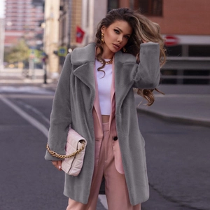 Women's mid-length grey faux fur coat with oversized lapels in trendy street style